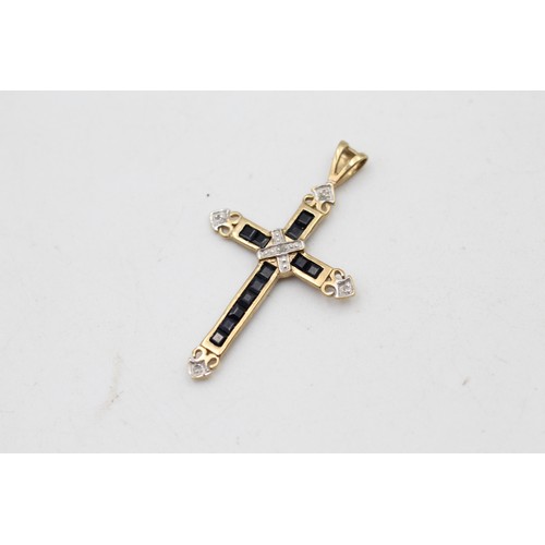 66 - 9ct gold diamond & sapphire cross pendant (1.3g)