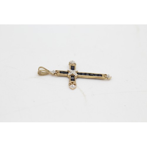 66 - 9ct gold diamond & sapphire cross pendant (1.3g)