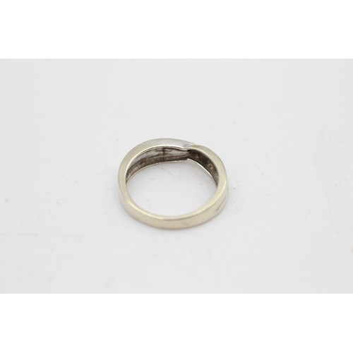 99 - 9ct white gold diamond crossover ring (2.5g) SIZE K