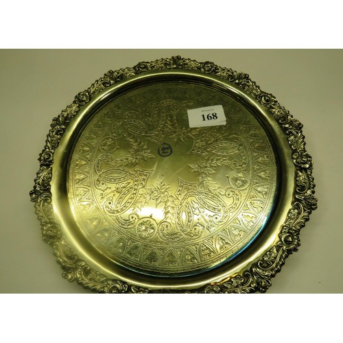 168 - SILVER PLATED ROUND SERVING TRAY WITH THREE ROUND LEGS OF ORNATE FOLIATE DESIGN