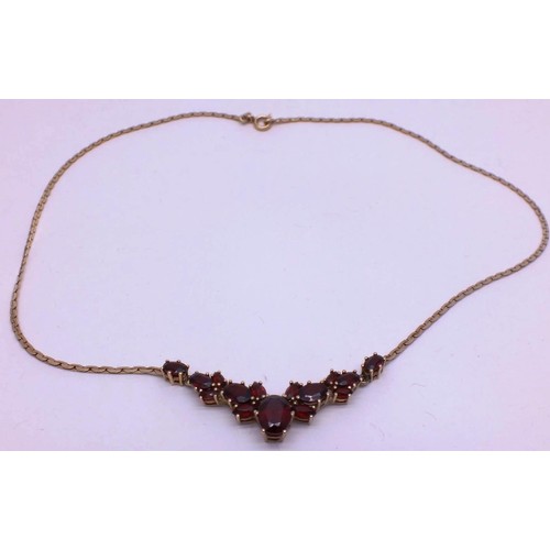 208 - 9ct GOLD CHAIN SET WITH GARNETS. 7g