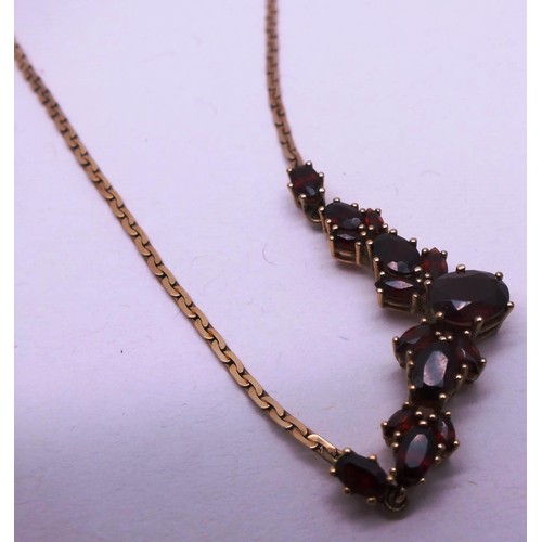 208 - 9ct GOLD CHAIN SET WITH GARNETS. 7g