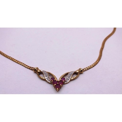 209 - 9ct GOLD CHAIN SET WITH RUBIES & DIAMONDS. 7g