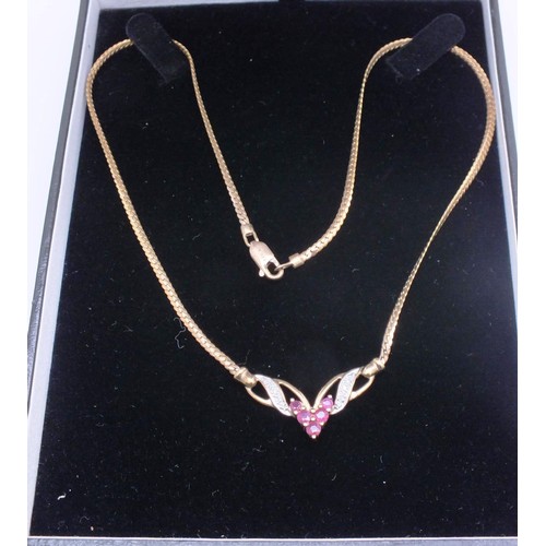 209 - 9ct GOLD CHAIN SET WITH RUBIES & DIAMONDS. 7g