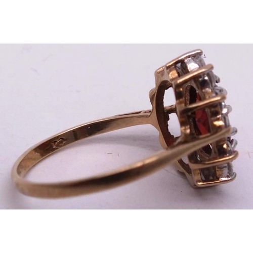 251 - 9CT GOLD RING RED STONE & CLEAR, SIZE K. 1g