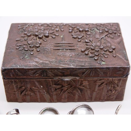 324 - VINTAGE ORIENTAL METAL RELIEF TIN WITH PAGODA AND CONTENTS INCLUDES JEWELERY, THIMBLES etc