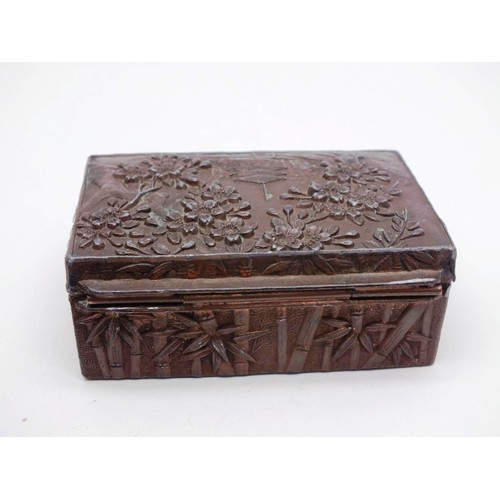 324 - VINTAGE ORIENTAL METAL RELIEF TIN WITH PAGODA AND CONTENTS INCLUDES JEWELERY, THIMBLES etc