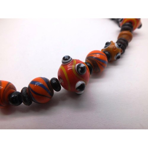 329 - VINTAGE BLACK AND ORANGE LAMPWORK GLASS BEAD NECKLACE APPROX LENGTH 18