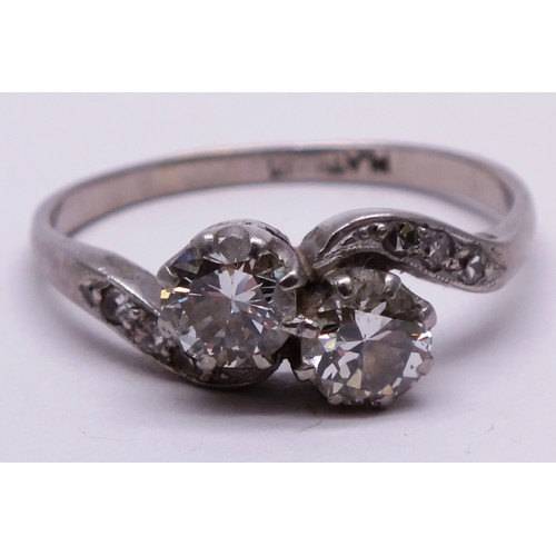 389 - PLATINUM DIAMOND LADIES RING WITH CROSSOVER TWIN DIAMONDS- SIZE N- 3.01G