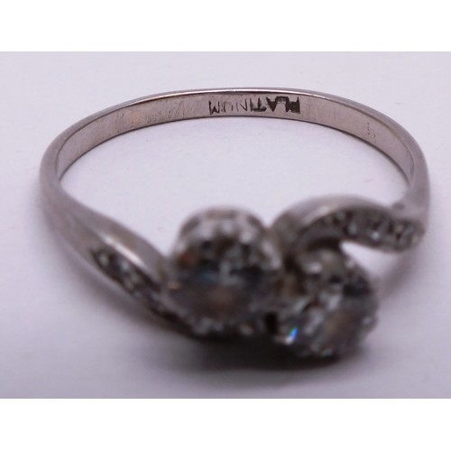 389 - PLATINUM DIAMOND LADIES RING WITH CROSSOVER TWIN DIAMONDS- SIZE N- 3.01G