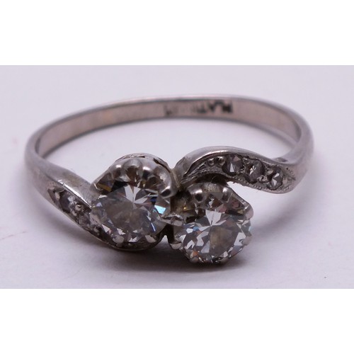 389 - PLATINUM DIAMOND LADIES RING WITH CROSSOVER TWIN DIAMONDS- SIZE N- 3.01G