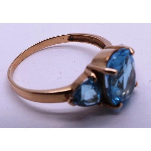 402 - 9CT GOLD LADIES RING WITH THREE LARGE BLUE STONES - SIZE O- 2.42G