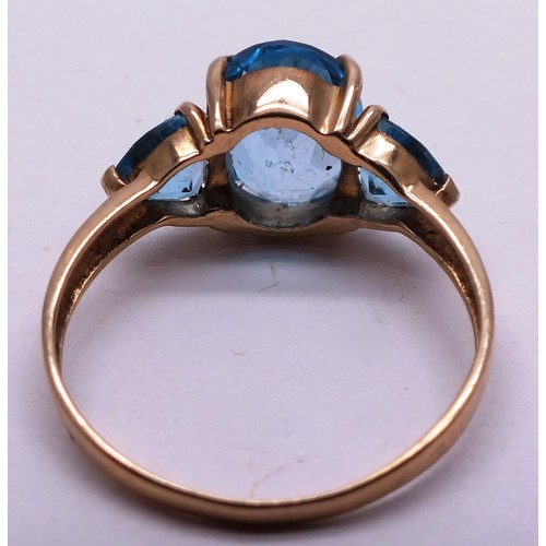 402 - 9CT GOLD LADIES RING WITH THREE LARGE BLUE STONES - SIZE O- 2.42G