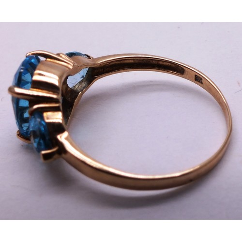 402 - 9CT GOLD LADIES RING WITH THREE LARGE BLUE STONES - SIZE O- 2.42G