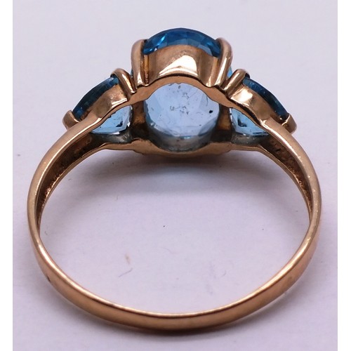 402 - 9CT GOLD LADIES RING WITH THREE LARGE BLUE STONES - SIZE O- 2.42G