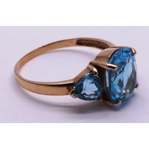 402 - 9CT GOLD LADIES RING WITH THREE LARGE BLUE STONES - SIZE O- 2.42G