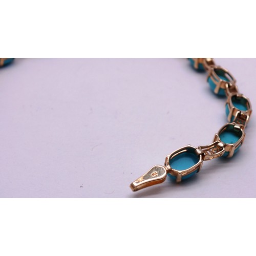 411 - 9 CARAT GOLD AND TURQUOISE BRACELET- 5GRAMS