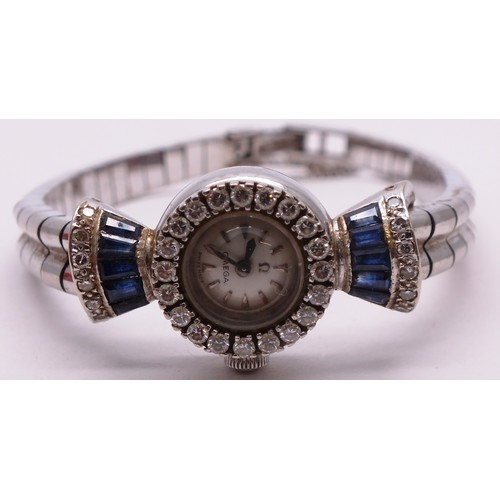 418 - 18CT WHITE GOLD LADIES OMEGA WATCH BOXED WITH SAPPHIRES AND DIAMONDS