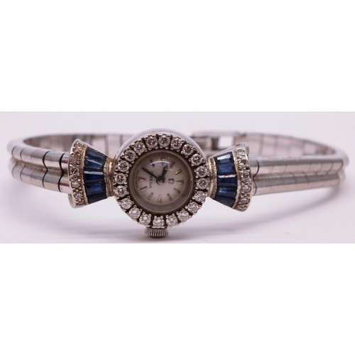 418 - 18CT WHITE GOLD LADIES OMEGA WATCH BOXED WITH SAPPHIRES AND DIAMONDS