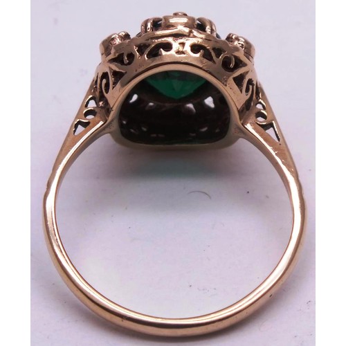 433 - 9CT GOLD OVAL CUT EMERALD HALO RING-SIZE M- 3.07G