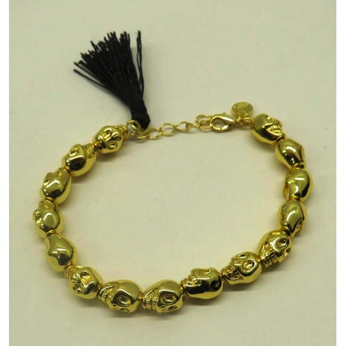 479 - TWO HARLEM CARTER GOLD PLATED SKULL BRACELETS