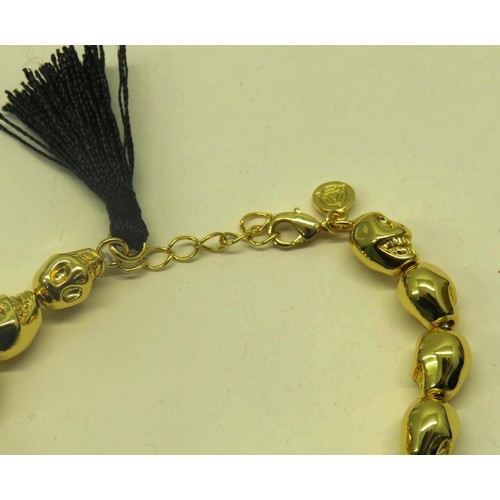 479 - TWO HARLEM CARTER GOLD PLATED SKULL BRACELETS