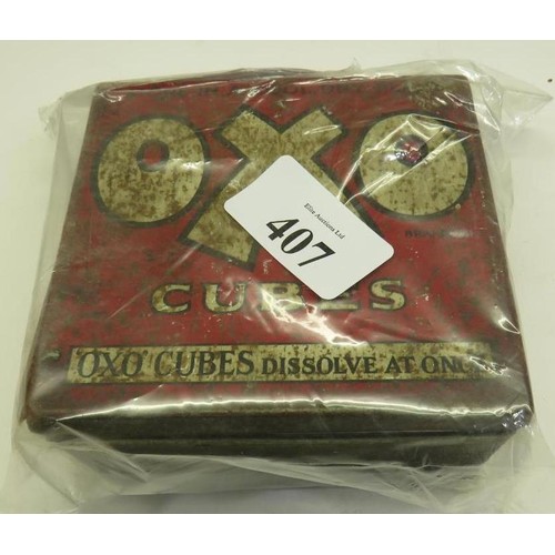 407 - OLD OXO TIN OF COINS