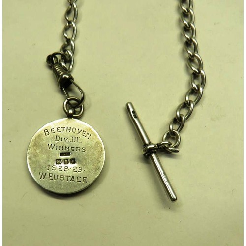 409 - SILVER AND GOLD FOOTBALL MEDAL ON SILVER ALBERT CHAIN