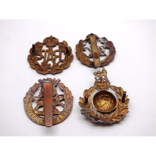 242 - FOUR MILITARY CAP BADGES INCLUDING R.A.F