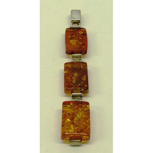 513 - TWO 925 SILVER AND AMBER PENDANTS