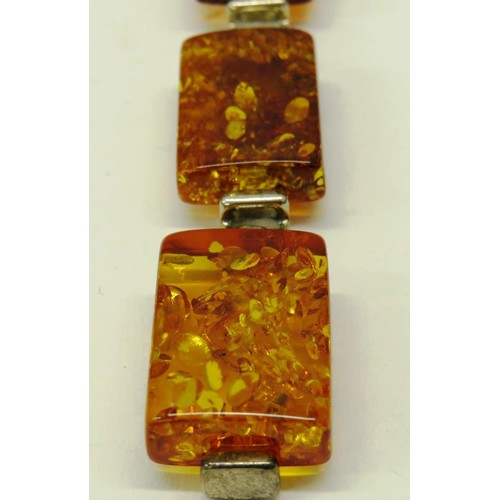 513 - TWO 925 SILVER AND AMBER PENDANTS