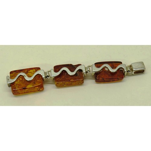 513 - TWO 925 SILVER AND AMBER PENDANTS