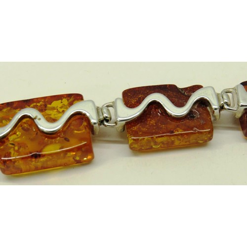 513 - TWO 925 SILVER AND AMBER PENDANTS