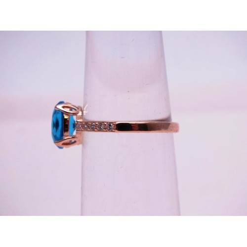 503 - 925 SILVER GILT BLUE AND CLEAR GEMSTONE RING SIZE R