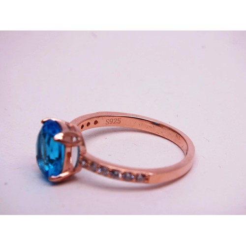 503 - 925 SILVER GILT BLUE AND CLEAR GEMSTONE RING SIZE R