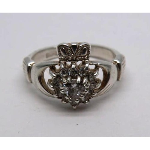 437 - 925 SILVER CLADDAGH RING SET WITH WHITE CZ STONES SIZE J