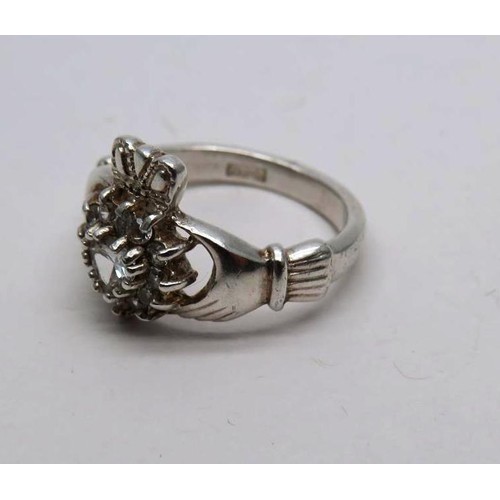 437 - 925 SILVER CLADDAGH RING SET WITH WHITE CZ STONES SIZE J