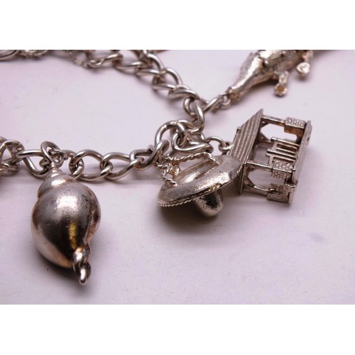 354 - VINTAGE SILVER CHARM BRACELET 66g