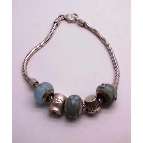 358 - TWO SILVER CHARM BRACELETS