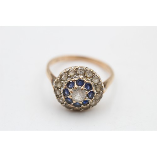 56 - 9ct gold sapphire & synthetic spinel halo ring (3.8g) SIZE T