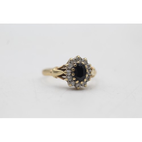 62 - 9ct gold sapphire & clear gemstone halo ring (2.4g) SIZE M