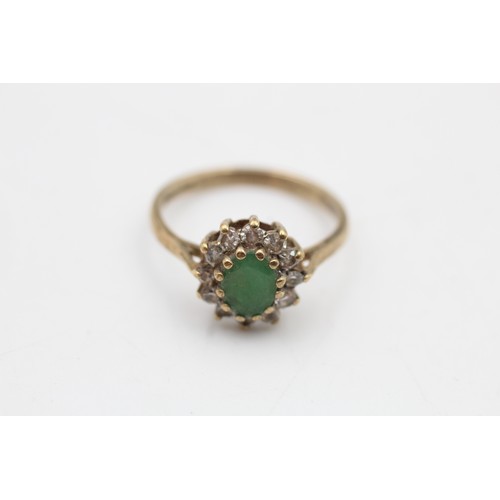 88 - 9ct gold emerald & clear gemstone halo ring (2.1g) SIZE N