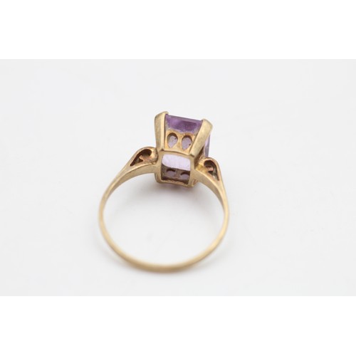 96 - 9ct gold amethyst emerald cut solitaire ring (2.3g) SIZE M