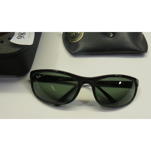 386 - TWO PAIRS OF CASED SUNGLASSES OAKLEY AND RAYBAN