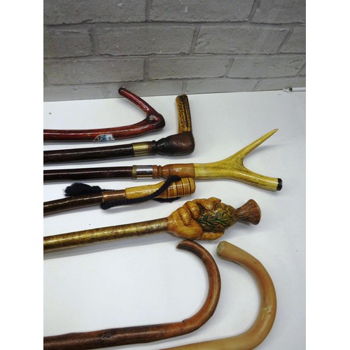 159 - 7 x ASSORTED WALKING STICKS INCLUDES HAND CARVED HAND HOLDING THISTLE STICK ETC