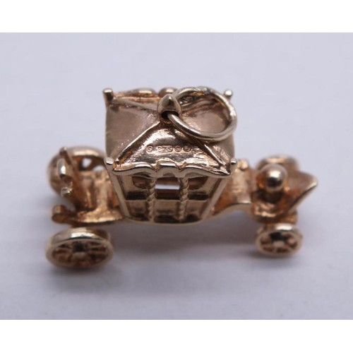 83 - 9ct GOLD CARRIAGE CHARM WITH MOVING WHEELS 3.5g