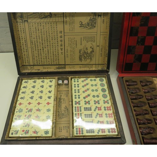 121 - TWO ORIENTAL FOLD UP GAME SETS - CHESS AND MAHJONG