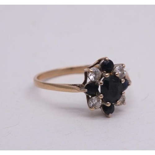 310 - 9CT GOLD RING SAPPHIRES AND CZ STONES