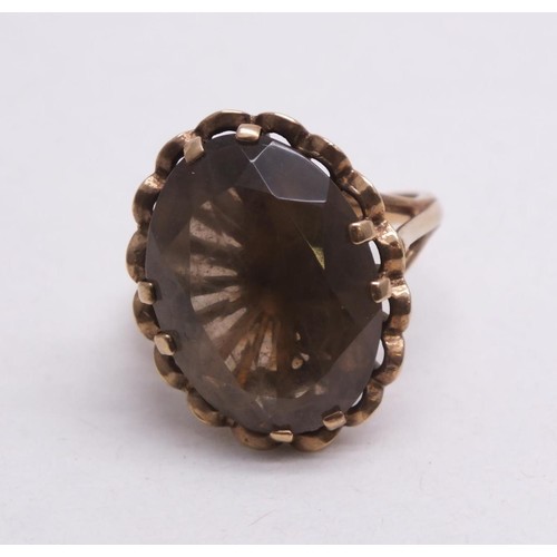 315 - 9CT GOLD RING LARGE SMOKEY QUARTZ STONE