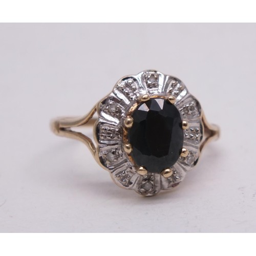 317 - 9CT GOLD RING LARGE SAPPHIRE AND DIAMONDS